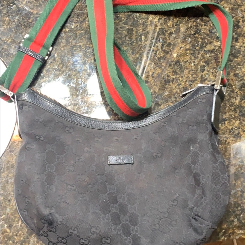 black Gucci messenger bag